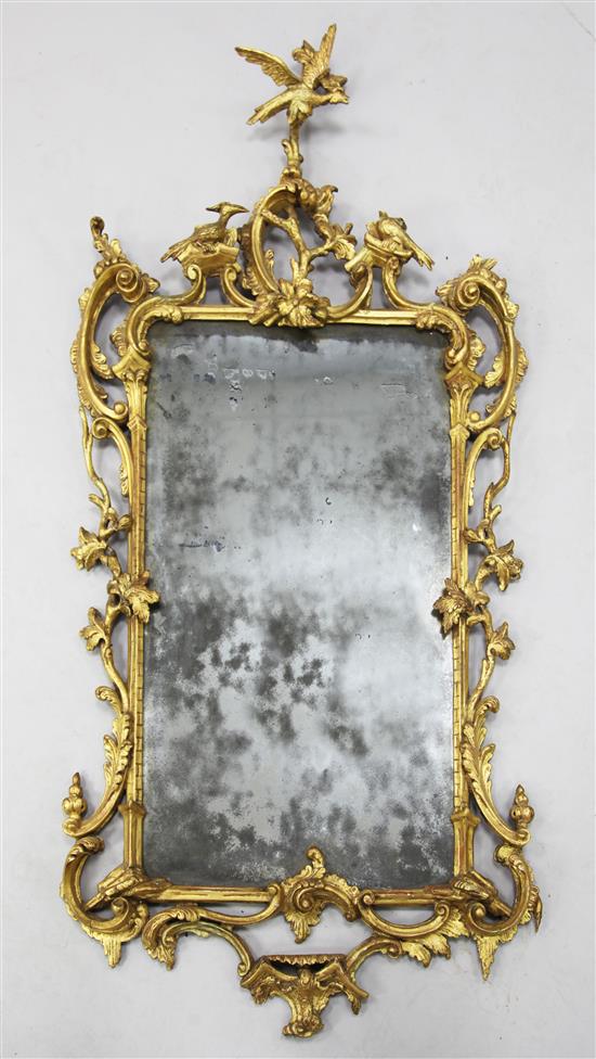 A George III Chippendale style carved and giltwood wall mirror, in the manner of Mathias Lock, W.2ft 3in. H.4ft 5in.